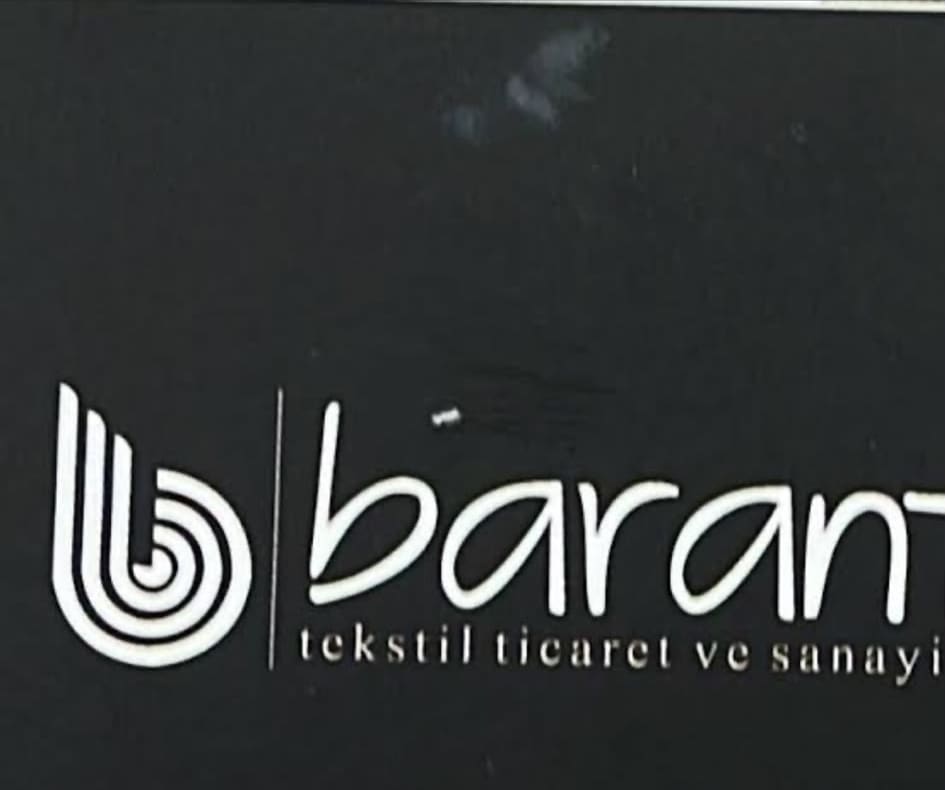 Baranteks signboard — black panel with the ringed-b monogram and lowercase wordmark
